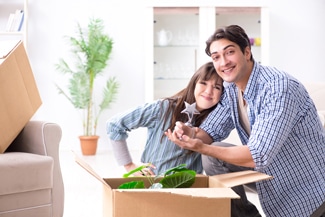A Couple Unpacking after Furniture Removals — Furniture removalists in Newcastle, NSW